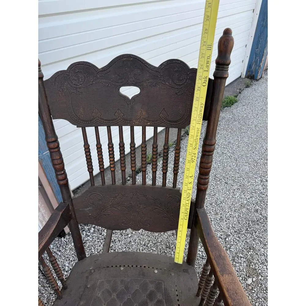 Antique Spindle Rocking Chair With Carvings and Cutout accent